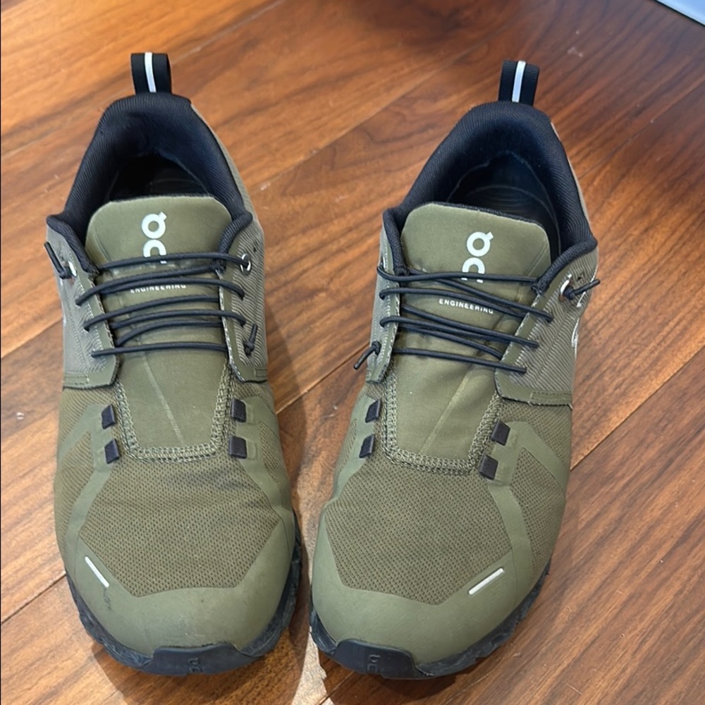 On Running Green and Black Athletic Shoes with Trail-Ready Design